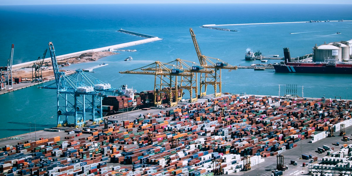 Aerial view of stacked shipping containers at a port