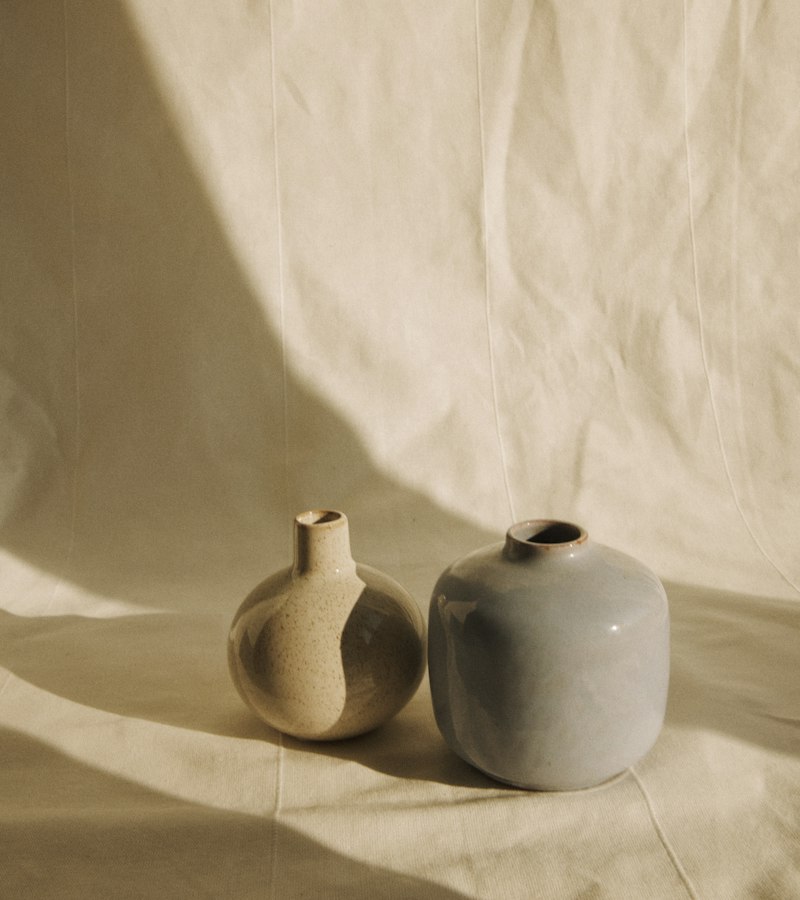 Ceramic vases on a table in warm light